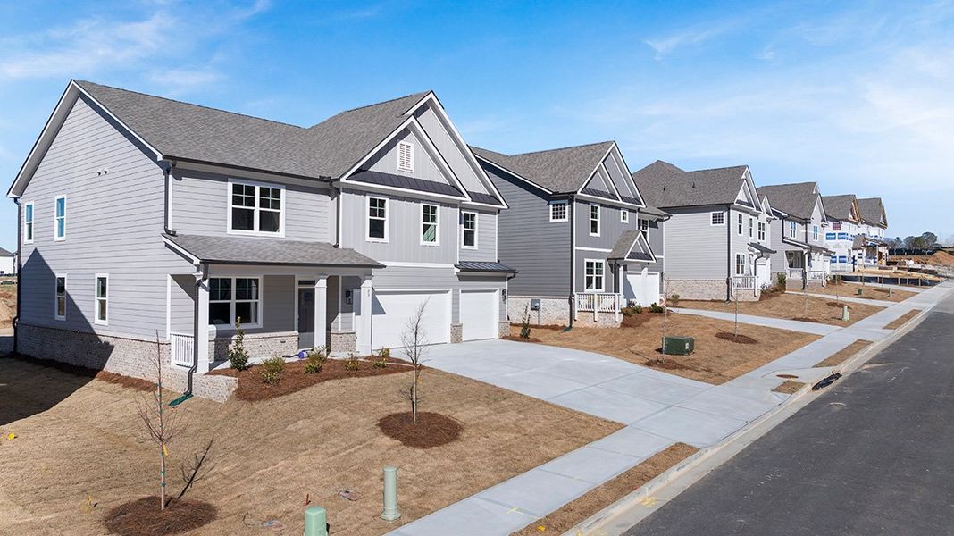 Front exterior of a home in the Hamptons at Riverwood East community, located in Dallas, GA (Image 15).