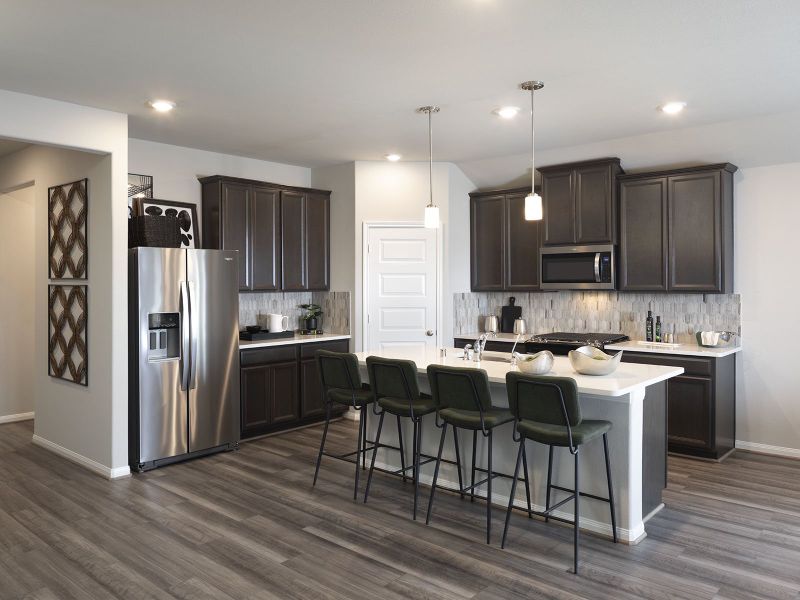 Cook meals as a family in your spacious kitchen.