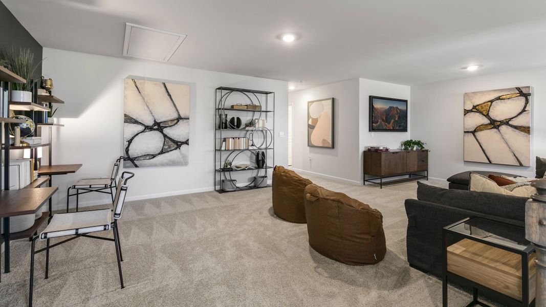 Furnished interior in a model home at The Meadows at Kinsley in Jamestown (Image 20).