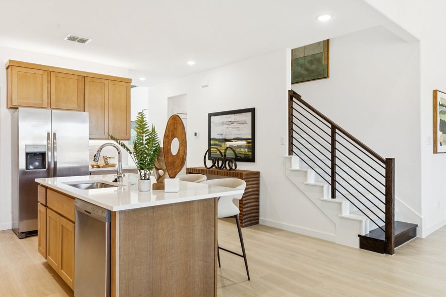 REPRESENTATIVE PHOTO – Kitchen in the Winters model home in Aledo TX by Trophy Signature Homes