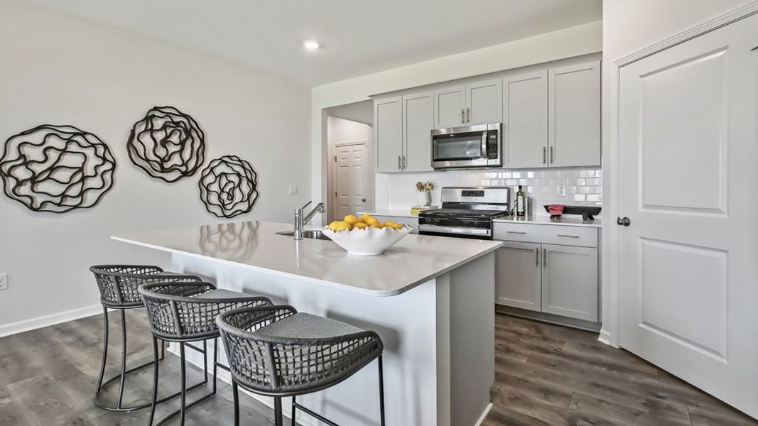 Furnished interior in a model home at The Landing at Winston Pointe in Clayton (Image 6). Furnished interior in a model home at The Landing at Winston Pointe in Clayton (Image 6).