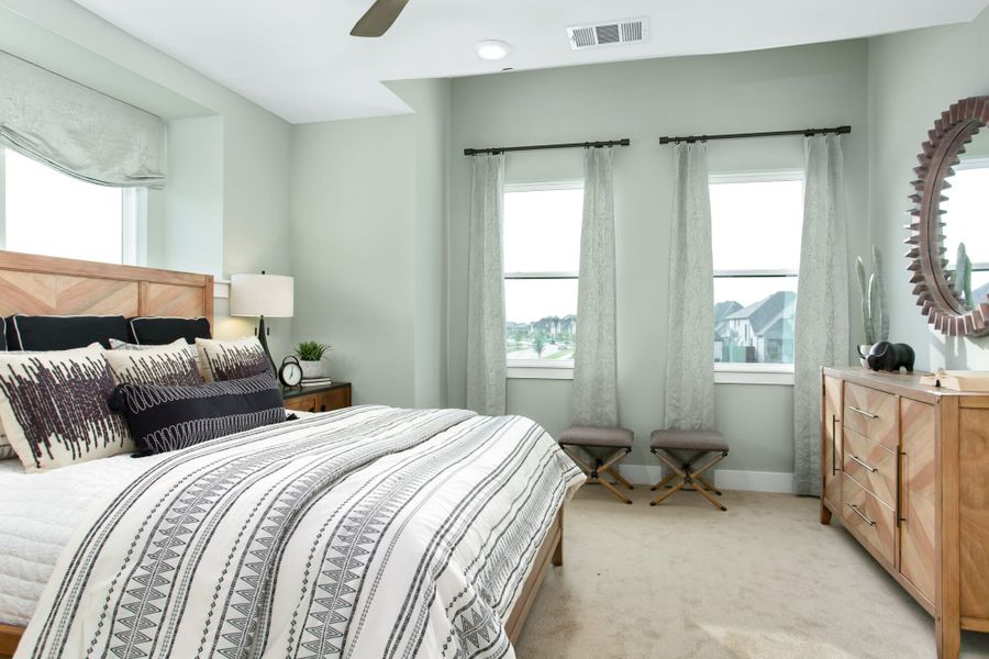 Furnished interior in a model home at Windsong Ranch Townhomes in Prosper (Image 26).