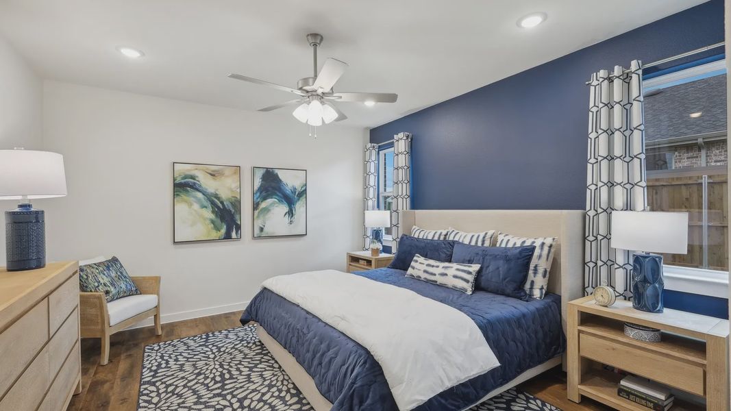 Luxurious Churchill bedroom with refined blue accents, modern furnishings, and rich wooden flooring. Luxurious Churchill bedroom with refined blue accents, modern furnishings, and rich wooden flooring.