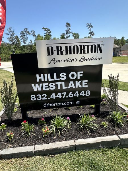 D.R. Horton welcomes you to the lush Hills of Westlake in Conroe, TX, featuring vibrant landscaping and a serene setting.