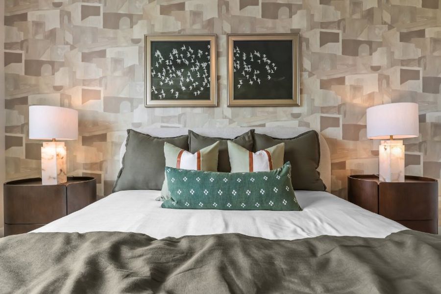 A bed with lamps on either side. A bed with lamps on either side.