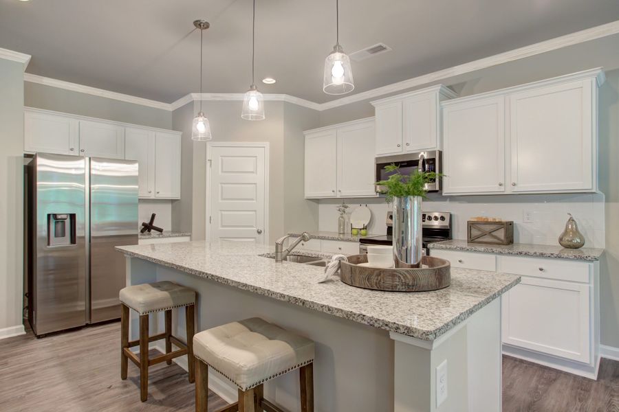 Furnished interior in a model home at Legends at Old Monroe in Monroe (Image 32).