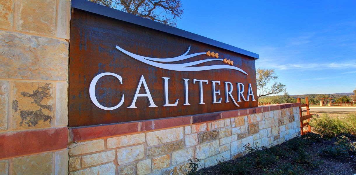 Entrance to the Caliterra community in Dripping Springs, TX, featuring signage and landscaping (Image 2). Entrance to the Caliterra community in Dripping Springs, TX, featuring signage and landscaping (Image 2).