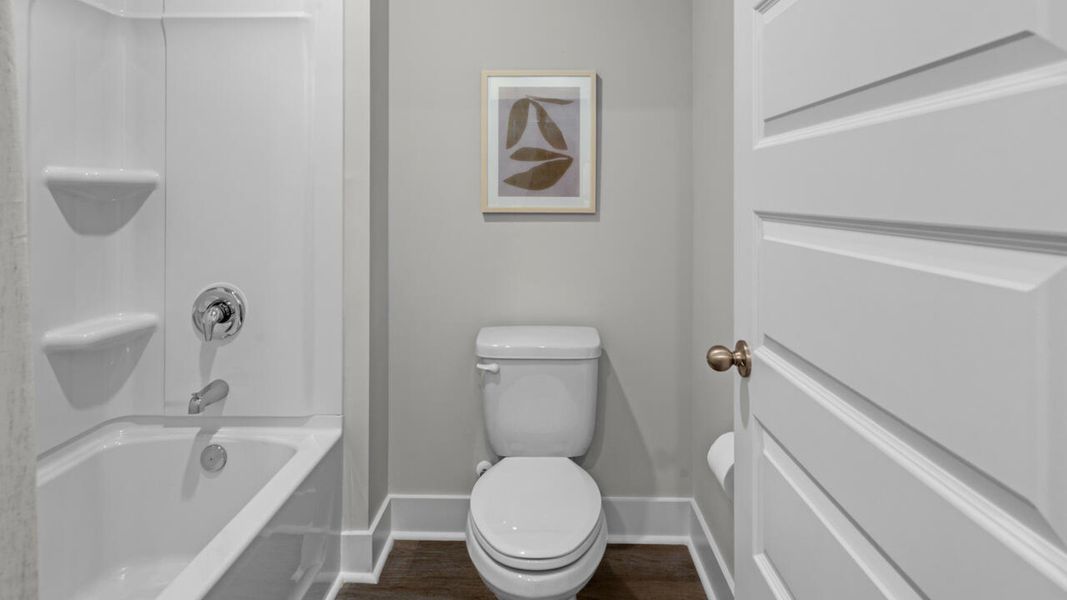 Furnished interior in a model home at Eagle Creek in Bolivia (Image 36).