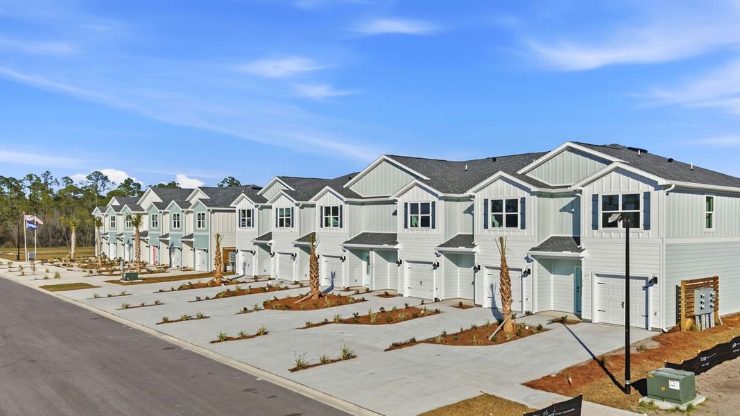 Front exterior of a home in the Colonial East Townhomes community, located in Panama City Beach, FL (Image 11).