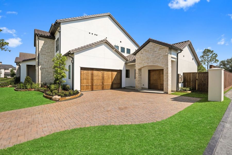 Front exterior of a home in the Carlton Woods Village of Creekside Park community, located in The Woodlands, TX (Image 2). Front exterior of a home in the Carlton Woods Village of Creekside Park community, located in The Woodlands, TX (Image 2).
