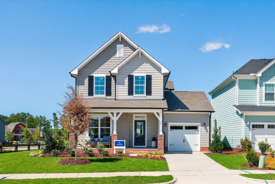Front exterior of a home in the Serenity - The Cottage Collection community, located in Fuquay Varina, NC (Image 4). Front exterior of a home in the Serenity - The Cottage Collection community, located in Fuquay Varina, NC (Image 4).