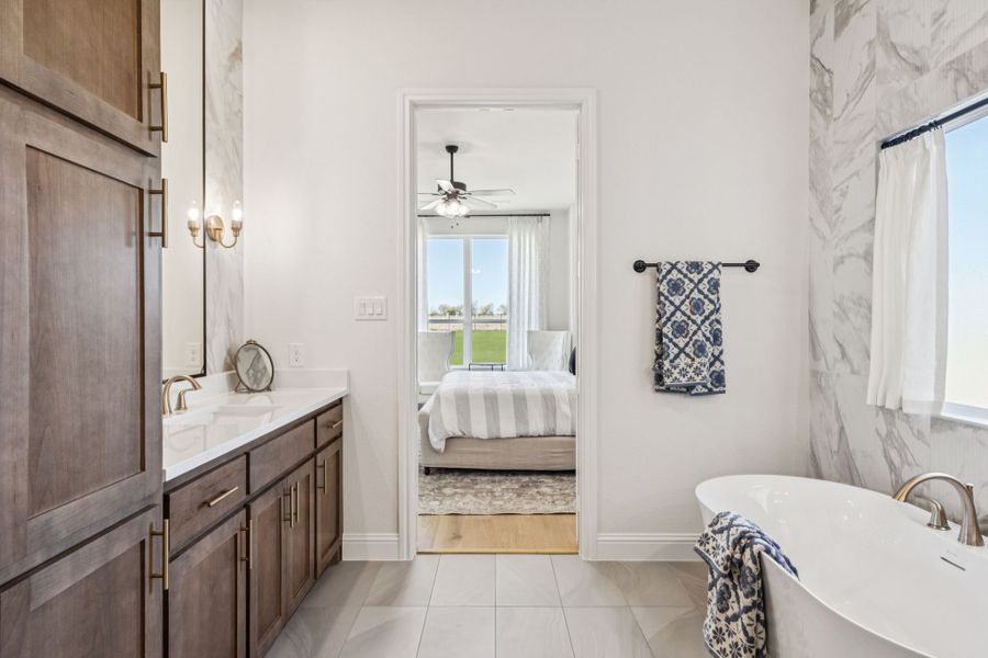 Furnished interior in a model home at Settler's Glen in New Fairview (Image 22).