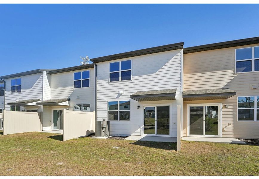 Exterior details of a home in Clinton Townhomes, Dade City (Image 3).