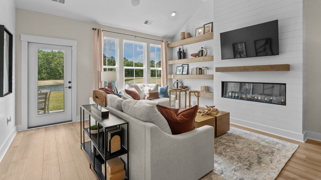 The Summit living room offers open-concept comfort and natural light throughout.