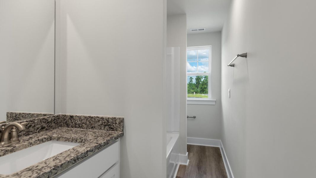 Furnished interior in a model home at Indigo Preserve Townhomes in Leland (Image 12).