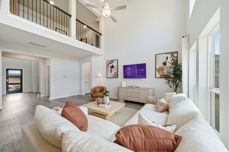 A living room with a large television.