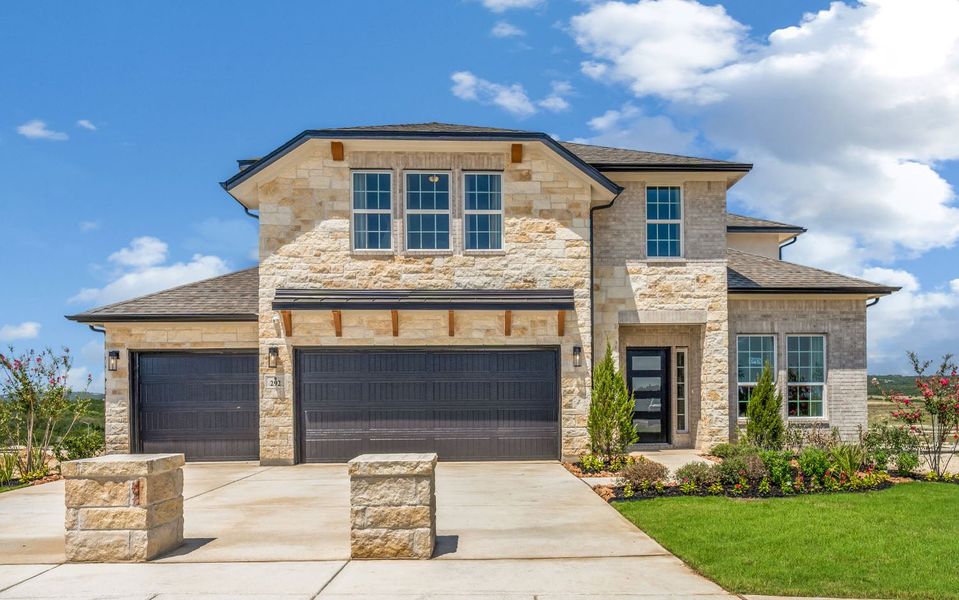 Front exterior of a home in the The Woodlands at Medina Hills community, located in Mico, TX (Image 2). Front exterior of a home in the The Woodlands at Medina Hills community, located in Mico, TX (Image 2).