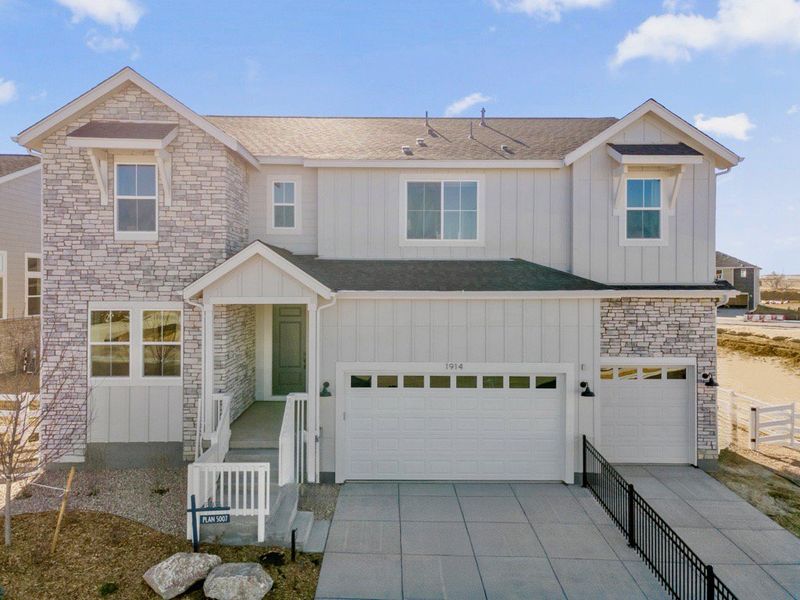 Front exterior of a home in the The Estates Collection at Murphy Creek community, located in Aurora, CO (Image 11).