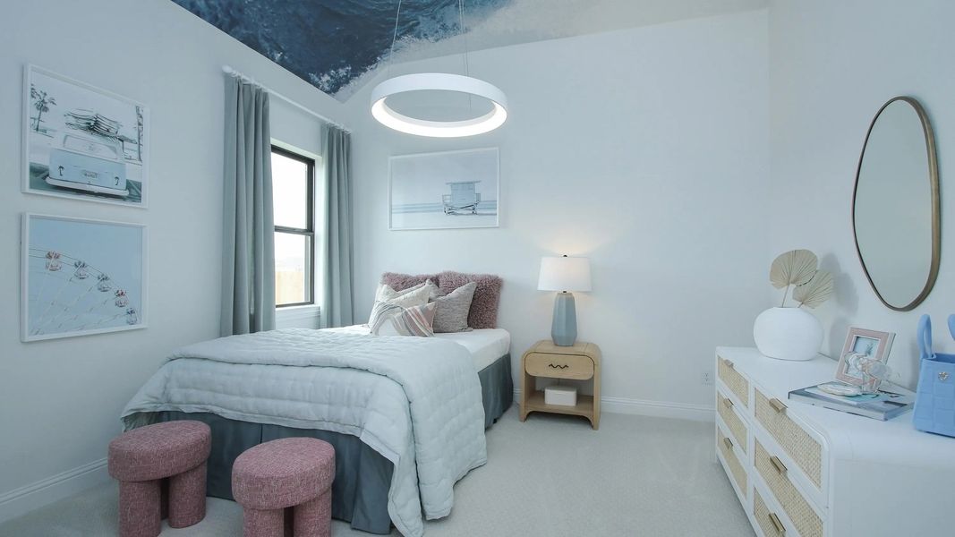 Experience serene elegance in this Coastal Point bedroom, featuring a stunning ocean ceiling and plush, modern furnishings.