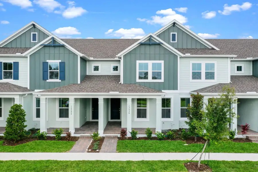 Front exterior of a home in the Harvest at Ovation - Townhomes community, located in Winter Garden, FL (Image 33).