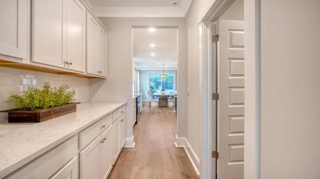 Furnished interior in a model home at Wappetaw Woods in Awendaw (Image 5).