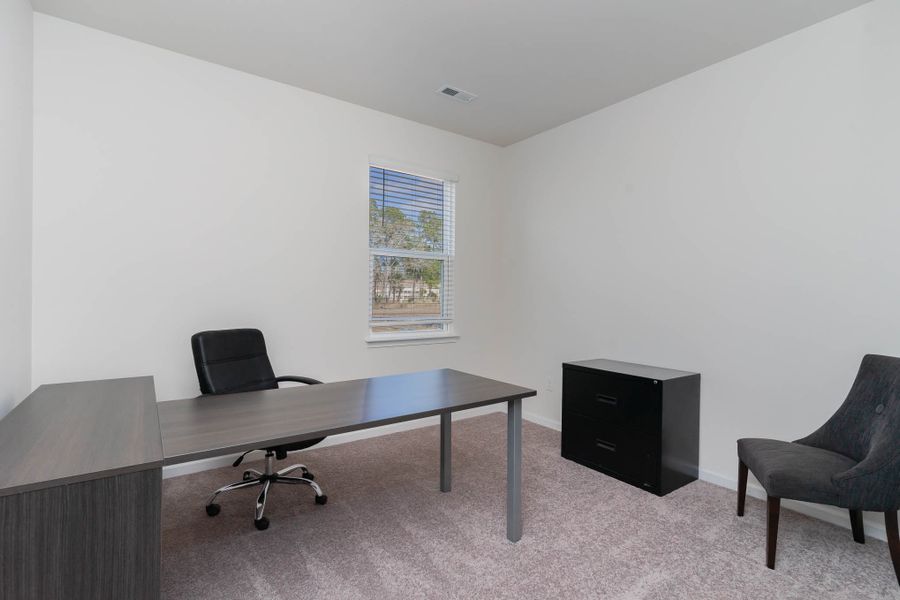 Furnished interior in a model home at Island Green in Myrtle Beach (Image 35).