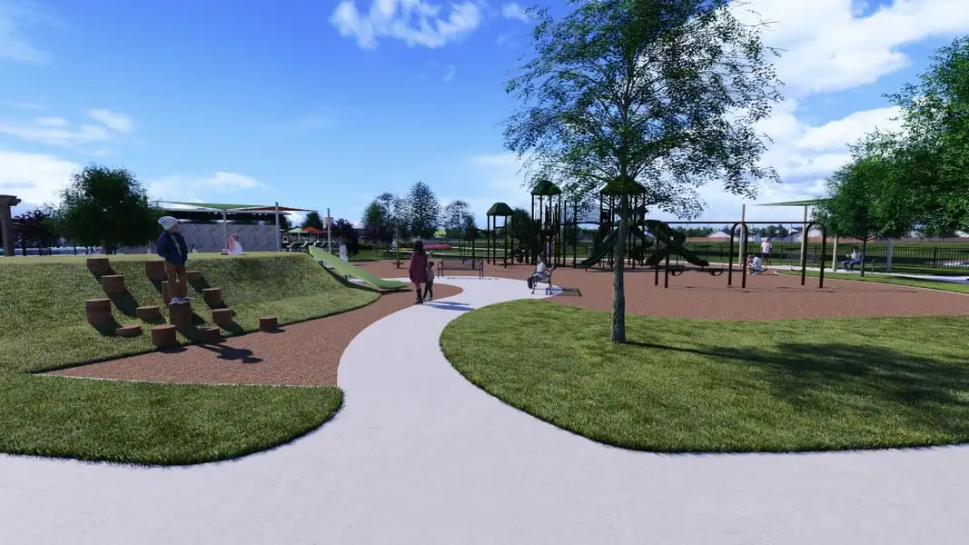 A group of people playing in a park. A group of people playing in a park.