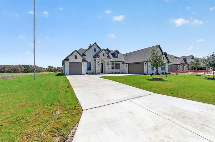 Front exterior of a home in the Paloma Ranches community, located in Justin, TX (Image 10).