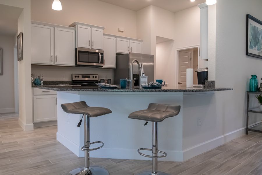 Furnished interior in a model home at North Port in North Port (Image 5).