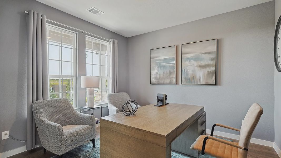 Discover refined elegance with large windows, patterned chairs, and sophisticated artwork in Patriot Estates. Discover refined elegance with large windows, patterned chairs, and sophisticated artwork in Patriot Estates.