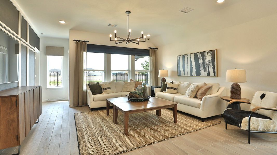 Exquisite wood flooring and chic furnishings adorn this Bridgeland living room. Exquisite wood flooring and chic furnishings adorn this Bridgeland living room.