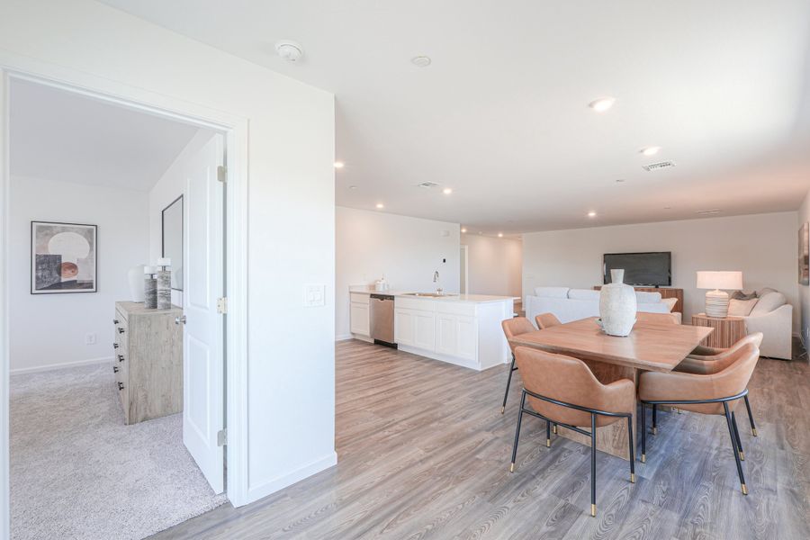 A room with a table and chairs.