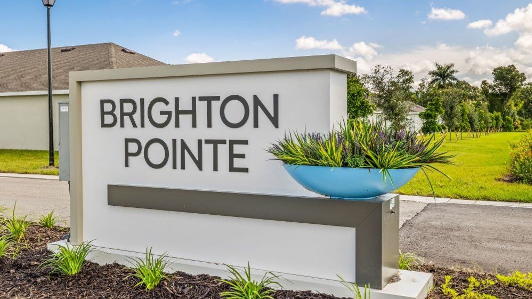 Entrance to the Brighton Pointe community in Fort Myers, FL, featuring signage and landscaping (Image 1). Entrance to the Brighton Pointe community in Fort Myers, FL, featuring signage and landscaping (Image 1).
