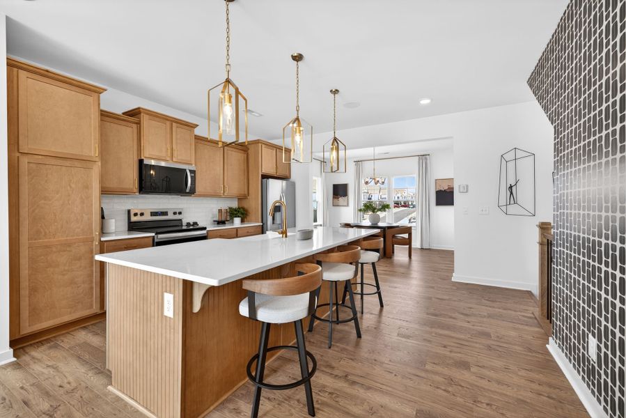 Furnished interior in a model home at North District at Flowers Plantation Townhomes in Clayton (Image 4).