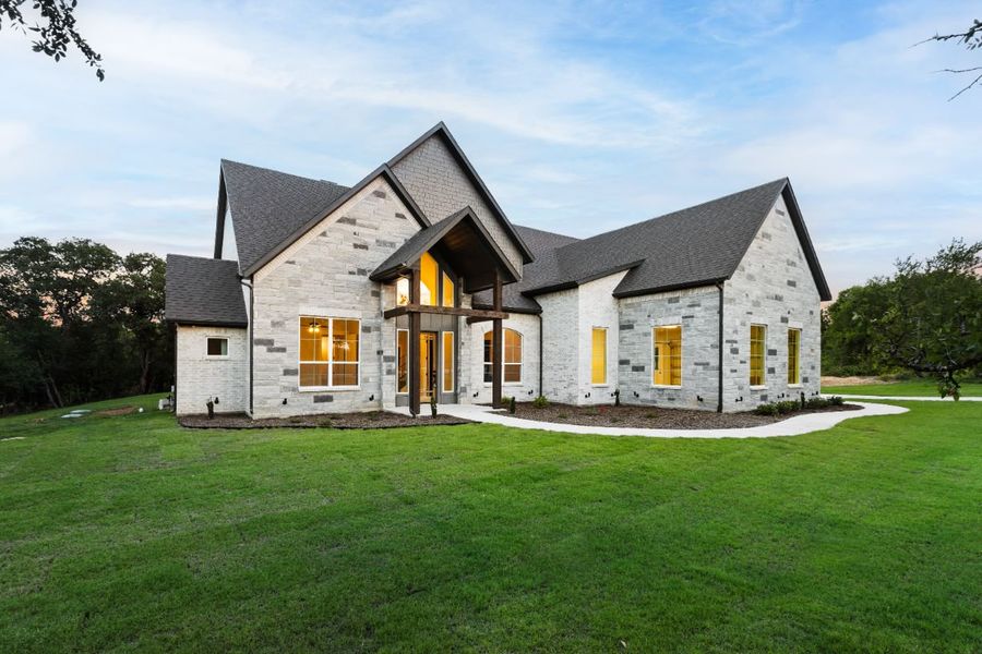 Front exterior of a home in the Lola Creek Ranch community, located in Boyd, TX (Image 13).