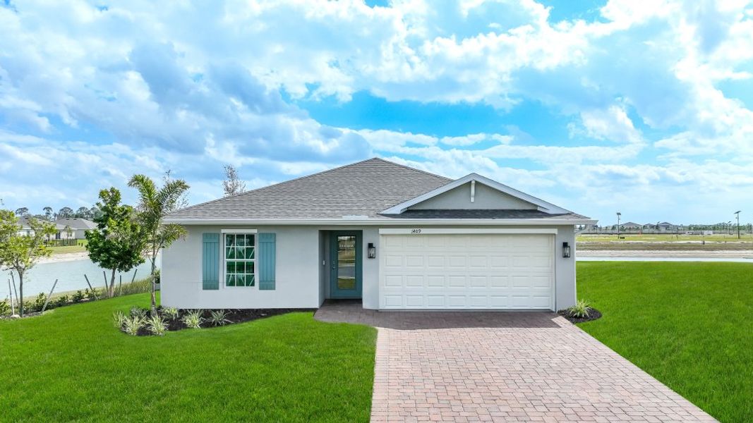 Front exterior of a home in the Cove at West Port - Express community, located in Port Charlotte, FL (Image 3).