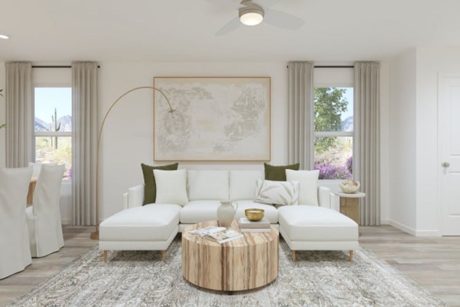 A living room with a white couch and a coffee table.