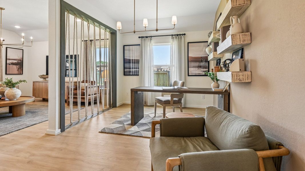 Elegant open-plan design with exquisite wood floors and rope divider in Cielo community.