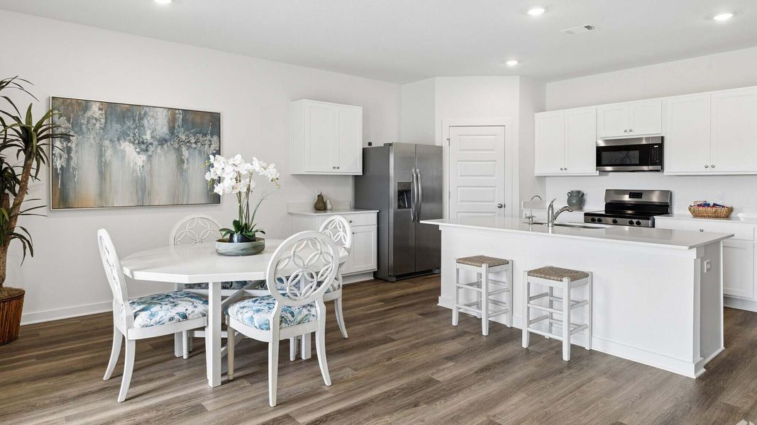 Furnished interior in a model home at Ashton Park Phase III in Freeport (Image 7).
