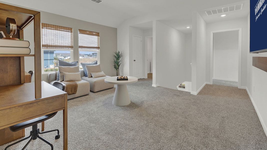 Furnished interior in a model home at Paramount in Kyle (Image 17).