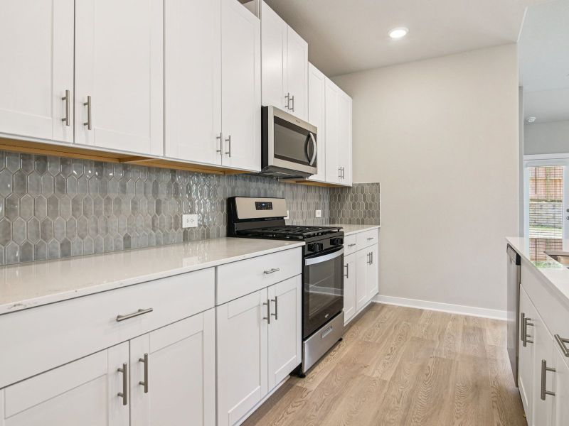 Furnished interior in a model home at Massey Oaks - Estate Series in Pearland (Image 6).