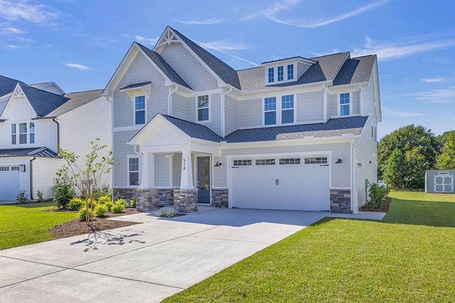 Front exterior of a home in the WyndWater community, located in Hampstead, NC (Image 34).