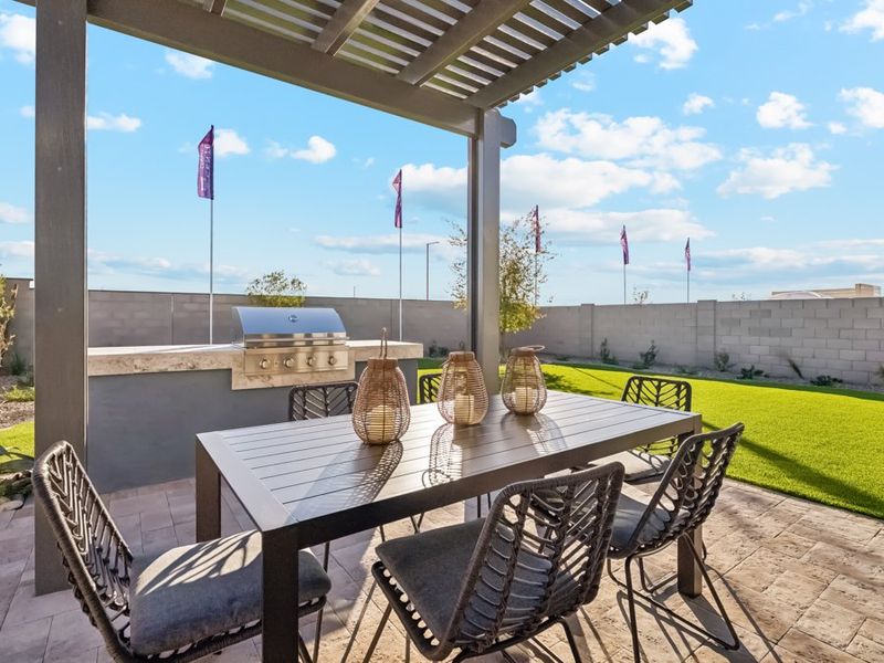 A table and chairs on a patio. A table and chairs on a patio.