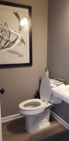 A modern bathroom featuring abstract art, sleek fixtures, and a neutral palette for a contemporary feel. A modern bathroom featuring abstract art, sleek fixtures, and a neutral palette for a contemporary feel.