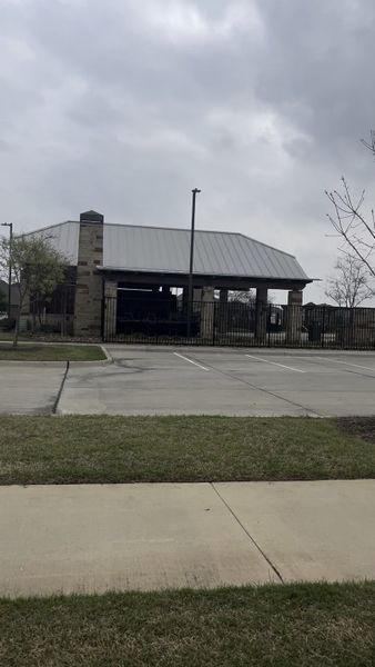 A modern pavilion with stone accents and a metal roof in Bridgewater: Classic Collection by Lennar (Princeton, TX).