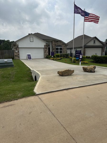 A charming brick and siding home with a manicured lawn in Lakes at Crockett Martin by Century Communities (Conroe, TX). A charming brick and siding home with a manicured lawn in Lakes at Crockett Martin by Century Communities (Conroe, TX).