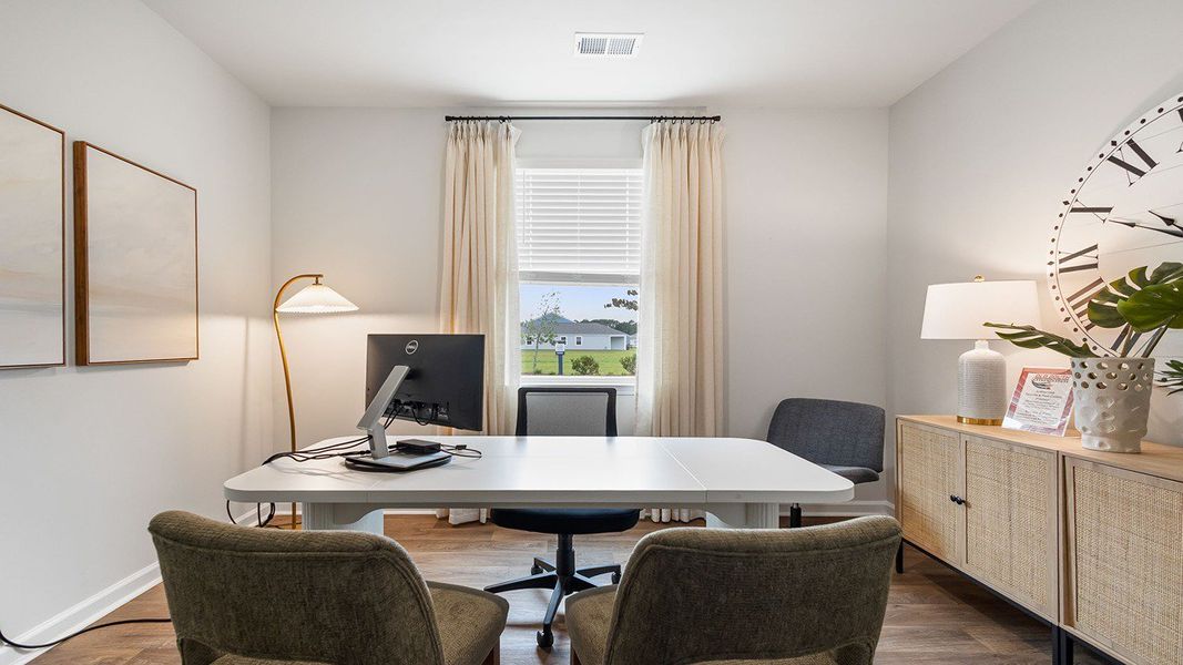 Furnished interior in a model home at Pine Hills at Cane Bay in Summerville (Image 8).