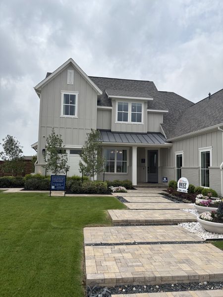 A beautiful modern home with a landscaped front yard in Solterra Texas by Shaddock Homes (Mesquite, TX).