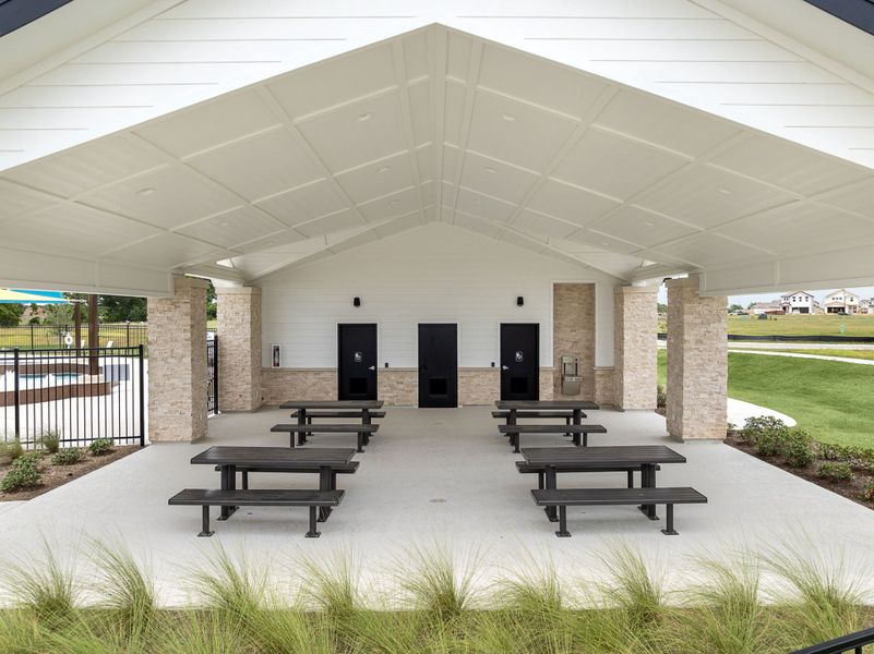 A building with benches and a covered area.