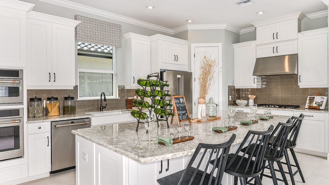 Furnished interior in a model home at Esplanade by the Islands in Naples (Image 48).